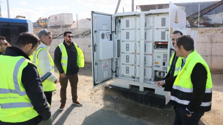EMS4PVBEV team inspecting electric vehicle charging infrastructure.